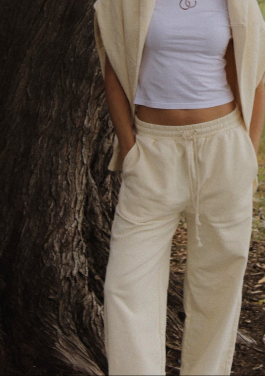 Person in a natural setting with a tree and open field